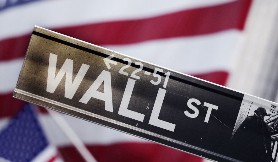 FILE - This Aug. 9, 2011 file photo shows a Wall Street street sign near the New York Stock Exchange, in New York. Global stock markets mostly rose Friday, Aug. 15, 2014 cheered by the prospect of more gains on Wall Street and a sense that Ukraine tensions are easing.  (AP Photo/Mark Lennihan, File)