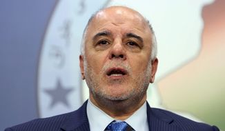 New Iraqi Prime Minister Haider al-Ibadi, a Shiite, has gotten votes of confidence from American and Iranian leaders about building a unity government in Baghdad. (associated press)