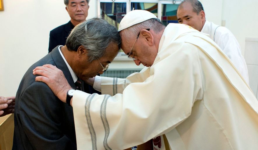 healer: Pope Francis greets Lee Ho-jin, father of one of the more than 300 victims of the sinking of a South Korean ferry — most of them high school students — in Seoul. As part of his trip, Francis outlined his desire for greater relations with Asian nations, especially China. (associated press/L&#39;osservatore romano)