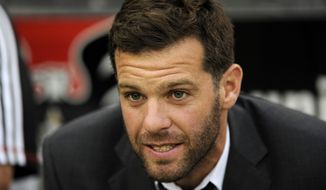 **FILE** D.C. United head coach Ben Olsen looks on from the bench before an MLS soccer game against the New England Revolution, Saturday, July 27, 2013, in Washington. (AP Photo/Nick Wass)
