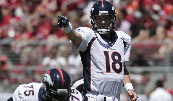 Denver Broncos quarterback Peyton Manning (18) signals at the line of scrimmage during the first quarter of an NFL preseason football game against the San Francisco 49ers in Santa Clara, Calif., Sunday, Aug. 17, 2014. (AP Photo/Marcio Jose Sanchez)