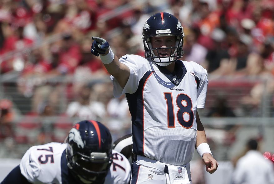 Denver Broncos quarterback Peyton Manning (18) signals at the line of scrimmage during the first quarter of an NFL preseason football game against the San Francisco 49ers in Santa Clara, Calif., Sunday, Aug. 17, 2014. (AP Photo/Marcio Jose Sanchez)