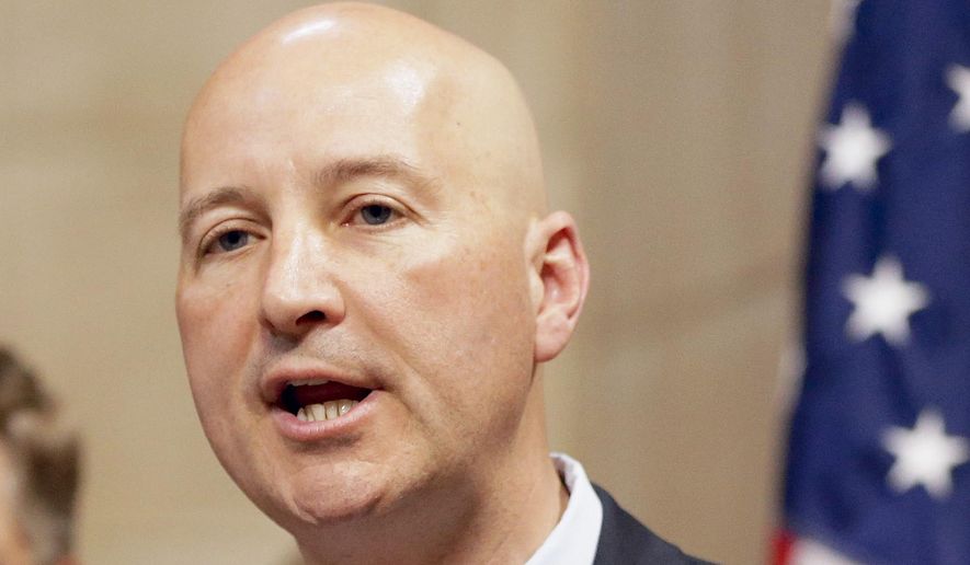 FILE - In this photo from June 2, 2014, Republican gubernatorial candidate Pete Ricketts speaks in Lincoln, Neb. Ricketts and Democrat gubernatorial candidate Chuck Hassebrook remain sharply divided over whether Nebraska should continue to deny driver's licenses for workers in the country illegally, as well as for young immigrants who were allowed to stay under an Obama administration initiative. (AP Photo/Nati Harnik, File)