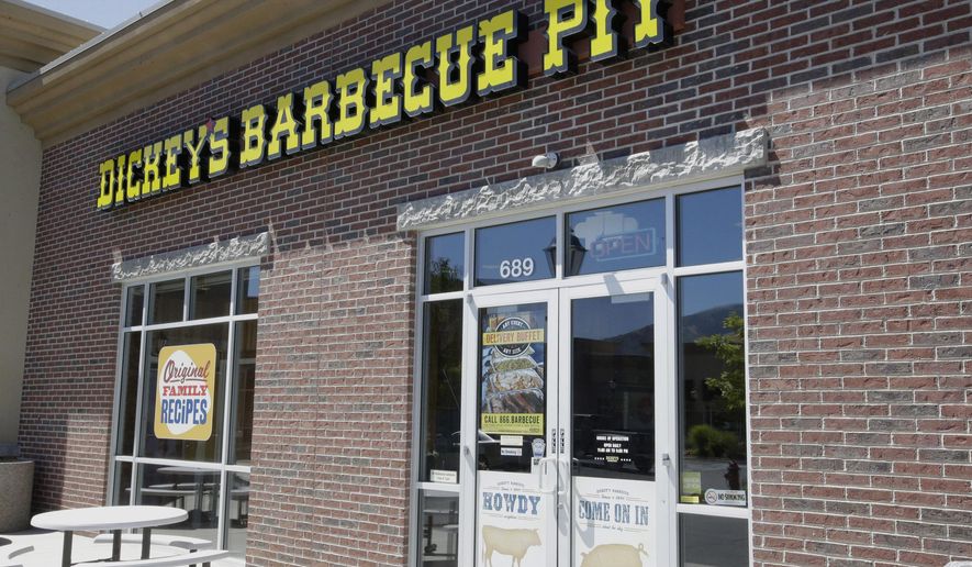 Dickey's Barbecue Pit is shown Monday, Aug. 18, 2014, in South Jordan, Utah. The Utah police agency investigating how iced tea that a woman drank at a restaurant ended up laced with an industrial cleaning solution is forwarding its findings to prosecutors to determine if anybody should be charged. Authorities have said an employee at Dickey's Barbecue in South Jordan unintentionally put the heavy-duty cleaner in a sugar bag, and a worker later mistakenly mixed it into the iced tea dispenser. (AP Photo/Rick Bowmer)