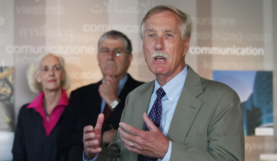 U.S .Sen. Angus King, right, speaks Monday, Aug. 18, 2014, in Portland, Maine during an event where he endorsed independent Eliot Cutler, center, for Maine governor. (AP Photo/Joel Page)