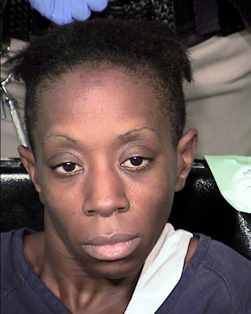 FILE - This July 30, 2014 file photo provided by the Las Vegas Metropolitan Police Department shows Natasha Galenn Jackson. A deputy public defender in Las Vegas raised a question about the mental state of Jackson who is facing multiple felony charges in a deadly crime spree that included a carjacking, two home invasions and a stabbing before police shot her alleged accomplice dead. Jackson pleaded not guilty Monday, Aug. 18, 2014, to murder, robbery, kidnapping, burglary and weapon charges that could get her life in prison if she's convicted.(AP Photo/Las Vegas Metropolitan Police Department, File)