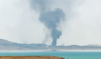 Smoke rises from airstrikes targeting Islamic State militants in Mosul, Iraq. (Associated Press)