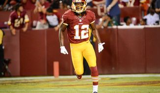 Washington Redskins wide receiver Andre Roberts (12) celebrates after a 49 yard catch to end the first quarter as the Washington Redskins play the Cleveland Browns in NFL preseason football at FedExField, Landover, Md., Monday, August 18, 2014. (Andrew Harnik/The Washington Times)