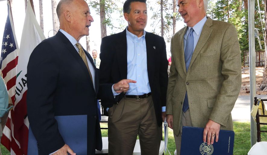 California Gov. Jerry Brown, left, talks with Nevada Gov. Brian Sandoval, center, and Rep. Tom McClintock, R-Calif., after they spoke a the 18th Annual Lake Tahoe Summit, Tuesday, Aug. 19, 2014, in South Lake Tahoe, Calif. McClintock, whose district includes the west side of Lake Tahoe, said that money from logging could help pay for forest improvements. (AP Photo/Rich Pedroncelli)