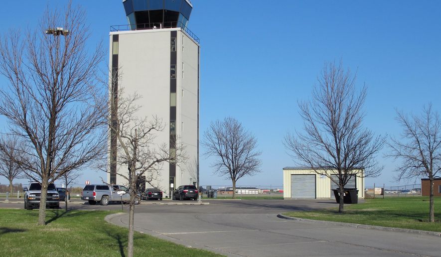 FILE - This May 11, 2013 file photo shows the air traffic control tower at the Fargo, N.D, airport, that is staffed 24 hours a day. The North Dakota Aeronautics Commission is getting a $433,000 federal grant to study airports in the state. U.S. Sens. John Hoeven and Heidi Heitkamp say the study will look at the economic impacts of airports, and also at ways to improve aviation throughout the state. Airline boardings at North Dakota's eight large airports have been booming in recent months, setting records in many cities. (AP Photo/Dave Kolpack, File)