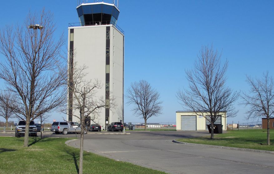 FILE - This May 11, 2013 file photo shows the air traffic control tower at the Fargo, N.D, airport, that is staffed 24 hours a day. The North Dakota Aeronautics Commission is getting a $433,000 federal grant to study airports in the state. U.S. Sens. John Hoeven and Heidi Heitkamp say the study will look at the economic impacts of airports, and also at ways to improve aviation throughout the state. Airline boardings at North Dakota's eight large airports have been booming in recent months, setting records in many cities. (AP Photo/Dave Kolpack, File)