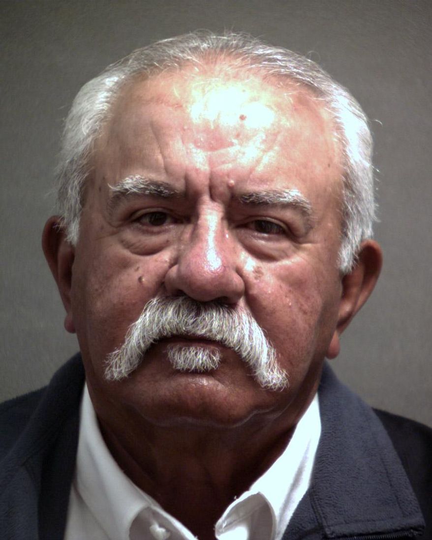 Emmett Benavidez is shown in this booking photo provided by the Randall County Sheriff's Office. The ex-Swisher County Sheriff of Tulia,Texas, accused of making improper advances to a female county worker, must serve 30 days in jail for misdemeanor official oppression. Benavidez pleaded guilty Monday, Aug 18, 2014 to misdemeanor official oppression. He will be allowed to serve the Randall County jail term on weekends, starting Friday, as part of the plea agreement. (AP Photo/ Randall County Sheriff’s Office)