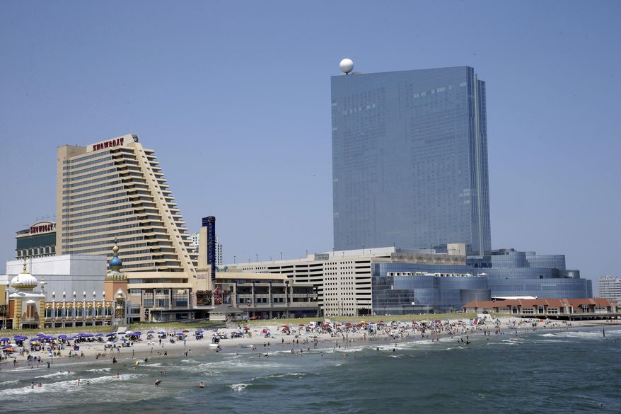 This Wednesday, July 23, 2014 photo shows the Showboat Casino Hotel, left, and the Revel Casino Hotel along the Boardwalk in Atlantic City, N.J. The state Gaming Enforcement Division gave final approval to Revel's shutdown on Sept. 1 and 2, signing the order on Tuesday night and releasing it on Wednesday, Aug. 20, 2014. Showboat and Revel are due to close over Labor Day weekend, with Trump Plaza shutting down on Sept. 16. The shutdowns are part of a rapid unraveling of Atlantic City's gambling market, which began the year with 12 casinos, but will have eight before summer ends. (AP Photo/Mel Evans)