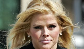 ** FILE ** In this Feb. 28, 2006, file photo, Anna Nicole Smith, leaves the U.S. Supreme Court in Washington, D.C. Smith&#x27;s final bid to obtain her late husband&#x27;s money has failed, seven years after her death. A federal judge in Santa Ana, Calif., on Monday, Aug. 18, 2014, rejected a bid by Smith&#x27;s estate to obtain about $44 million from the estate of J. Howard Marshall II, her late Texas billionaire husband. (AP Photo/Manuel Balce Ceneta, File)
