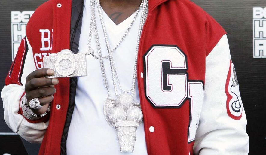 FILE - In this Oct. 2, 2010 file photo, rapper Gucci Mane arrives on the red carpet for the BET Hip Hop Awards in Atlanta. Gucci Mane, who pleaded guilty to a federal firearms charge several months ago, is set to be sentenced. The 34-year-old, whose real name is Radric Davis, pleaded guilty in May to a charge of possession of a firearm by a convicted felon after reaching an agreement with prosecutors. He is to be sentenced Wednesday, Aug. 20, 2014. (AP Photo/John Amis, File)