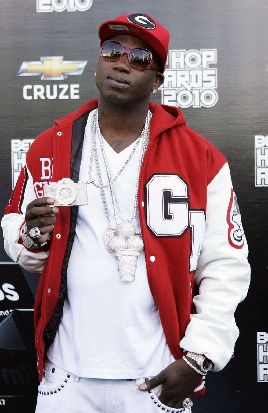 FILE - In this Oct. 2, 2010 file photo, rapper Gucci Mane arrives on the red carpet for the BET Hip Hop Awards in Atlanta. Gucci Mane, who pleaded guilty to a federal firearms charge several months ago, is set to be sentenced. The 34-year-old, whose real name is Radric Davis, pleaded guilty in May to a charge of possession of a firearm by a convicted felon after reaching an agreement with prosecutors. He is to be sentenced Wednesday, Aug. 20, 2014. (AP Photo/John Amis, File)