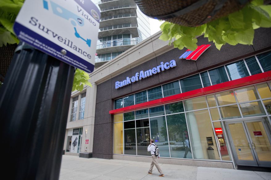 FILE - This July 16, 2013, file photo shows a Bank of America branch on Peachtree Street, in Atlanta. How much will Bank of America’s expected $17 billion mortgage settlement cost the company? The answer is, almost certainly not $17 billion. In mega-settlements negotiated with the U.S. government, a dollar is rarely worth an actual dollar. Inflated figures make sensational headlines for the Justice Department, and $17 billion would be the largest settlement by far arising from the economic meltdown in which millions of Americans lost their homes to foreclosure. But the true cost to companies is often obscured by opaque accounting techniques. (AP Photo/David Goldman, File)