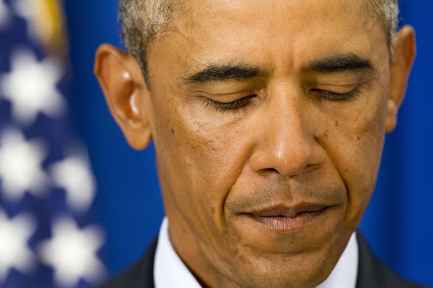President Barack Obama pauses as he speak in Edgartown, Mass., Wednesday, Aug. 20, 2014, about the killing of American journalist James Foley by militants with the Islamic State extremist group. The president said the US will continue to confront Islamic State extremists despite the brutal murder of journalist James Foley. Obama said the entire world is "appalled" by Foley's killing. The president says he spoke Wednesday with Foley's family and offered condolences. (AP Photo/Jacquelyn Martin)