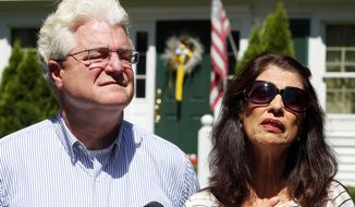 Diane and John Foley talk to reporters after speaking with U.S. President Barack Obama Wednesday, Aug. 20, 2014 outside their home in Rochester, N.H. Their son, James Foley was abducted in November 2012 while covering the Syrian conflict. Islamic militants posted a video showing his murder on Tuesday and said they killed him because the U.S. had launched airstrikes in northern Iraq. (AP Photo/Jim Cole)