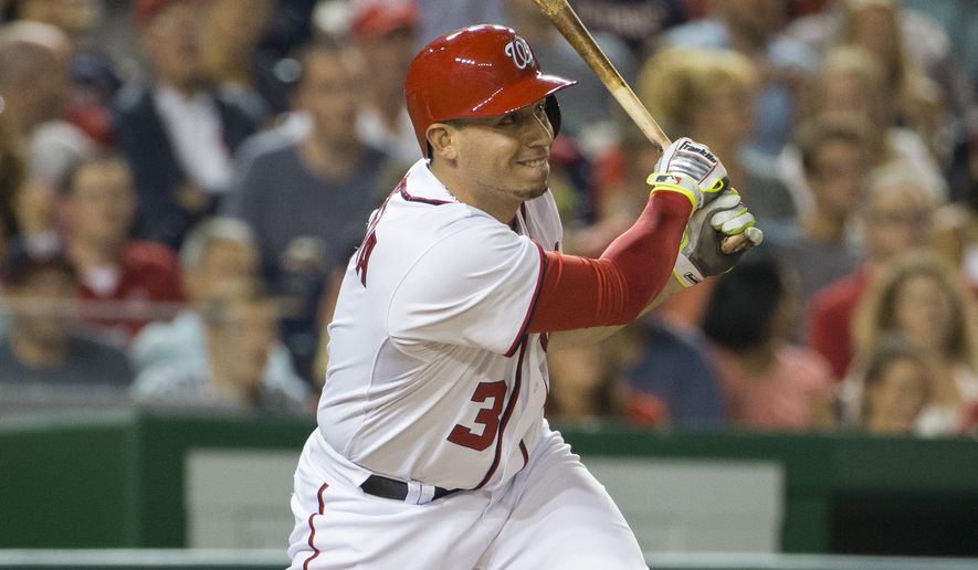 Washington Nationals' Asdrubal Cabrera watches his three-run double during the third inning of a baseball game against the Arizona Diamondbacks on Tuesday, Aug. 19, 2014, in Washington. (AP Photo/Evan Vucci)