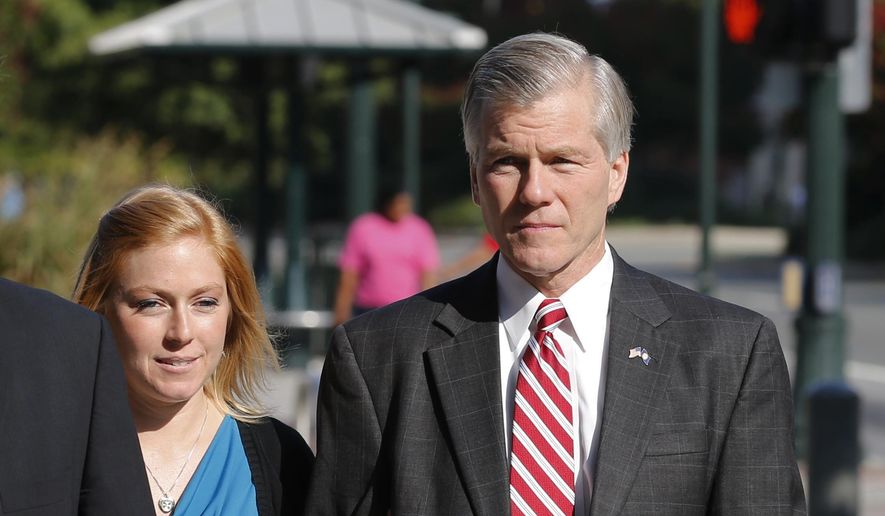Former Virginia Gov. Bob McDonnell arrives at federal court with his daughter Cailin Young, in Richmond, Va., Thursday, Aug. 21, 2014. McDonnell begins the second day of testimony in his own defense on corruption charges. (AP Photo/Steve Helber)