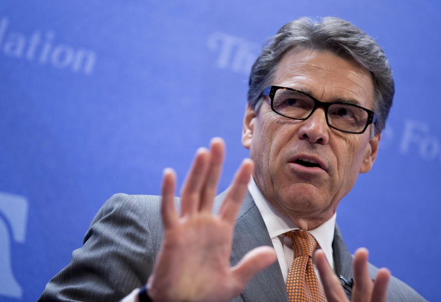Texas Gov. Rick Perry speaks at the Heritage Foundation in Washington, Thursday, Aug. 21, 2014, about he would be open to sending U.S. combat forces to Iraq to fight the deadly Islamic State after its attacks on a Christian minority and the beheading of an American journalist. (AP Photo/Manuel Balce Ceneta)