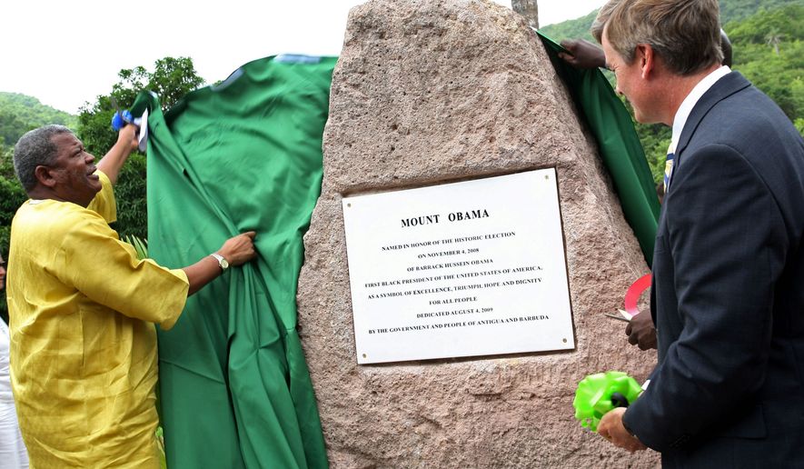 Prime Minister Baldwin Spencer of Antigua and Barbuda (left), unveils a stone during a ceremony naming Antigua&#x27;s highest mountain &quot;Mount Obama.&quot; The president&#x27;s name has also been lent in rechristenings at other places around the globe. (Associated Press)