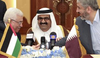 ** FILE ** In this Monday, Feb. 6, 2012 file photo, Palestinian President Mahmoud Abbas, left, shakes hands with Hamas leader Khaled Mashaal, right, as the then Emir of Qatar, Sheik Hamad bin Khalifa Al Thani, looks on after signing an agreement in Doha, Qatar. The explosions rocking the Gaza Strip may seem far removed from the flashy cars and skyscrapers of ultra-rich Qatar, but efforts to end fighting between Hamas and Israel could hinge on how the tiny Gulf state wields its influence over a militant group with few friends left. (AP Photo/Osama Faisal, File)