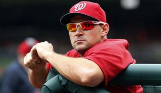 Washington Nationals left fielder Ryan Zimmerman rests in the dugout before a baseball game against the Philadelphia Phillies at Nationals Park Sunday, Aug. 3, 2014, in Washington. (AP Photo/Alex Brandon)