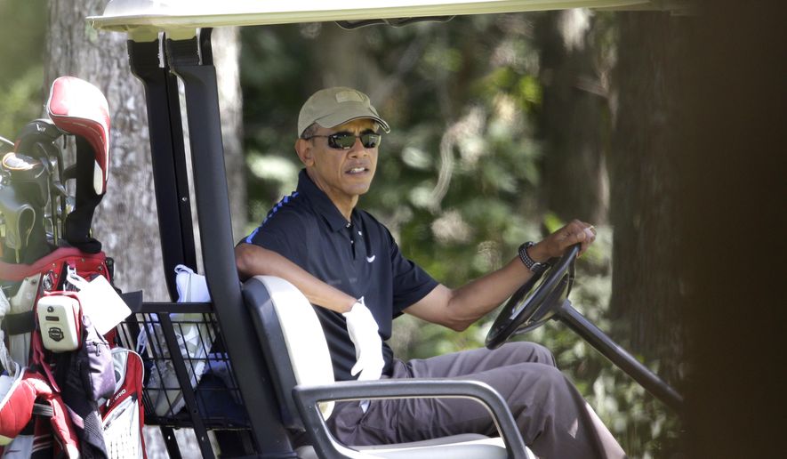 President Barack Obama sits in a golf cart while golfing at Farm Neck Golf Club, in Oak Bluffs, Mass., on the island of Martha&#x27;s Vineyard, Thursday, Aug. 21, 2014. Obama is vacationing on the island. (AP Photo/Steven Senne)