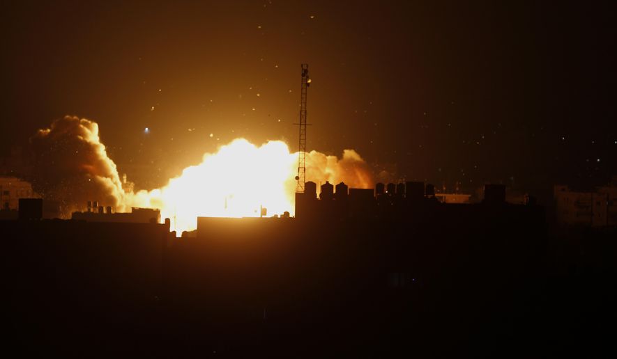 A ball of fire rises following an Israeli air strike on a building in Gaza, in the northern Gaza Strip, Friday, Aug. 22, 2014. The airstrike came as Israeli Prime Minister Benjamin Netanyahu warned Hamas would pay a ``heavy price’’ for the killing of a 4-year-old boy by a mortar shell fired from Gaza earlier Friday. (AP Photo/Adel Hana)