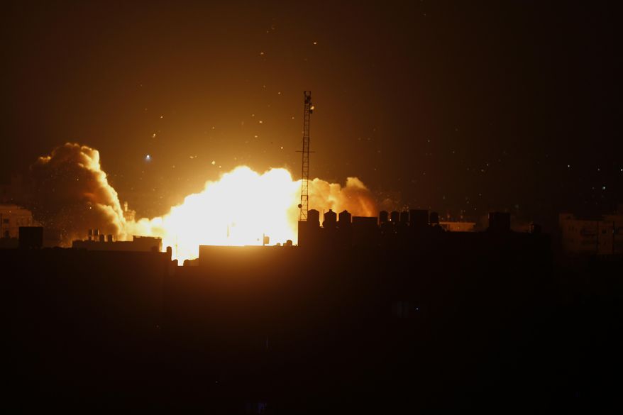 A ball of fire rises following an Israeli air strike on a building in Gaza, in the northern Gaza Strip, Friday, Aug. 22, 2014. The airstrike came as Israeli Prime Minister Benjamin Netanyahu warned Hamas would pay a ``heavy price’’ for the killing of a 4-year-old boy by a mortar shell fired from Gaza earlier Friday. (AP Photo/Adel Hana)