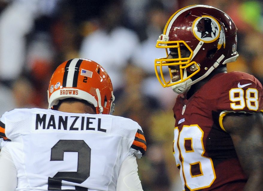 Washington Redskins outside linebacker Brian Orakpo (98) reacts after Cleveland Browns quarterback Johnny Manziel (2) was sacked during the first half of an NFL preseason football game Monday, Aug. 18, 2014, in Landover, Md. (AP Photo/Richard Lipski)