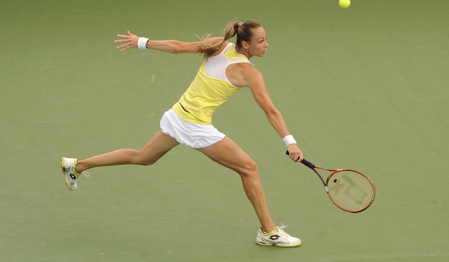 Magdalena Rybarikova, of Slovakia, stretches to return a serve during her 6-4, 6-2 loss to Petra Kvitova, of the Czech Republic, in the final match of the Connecticut Open tennis tournament in New Haven, Conn., on Saturday, Aug. 23, 2014. (AP Photo/Fred Beckham)