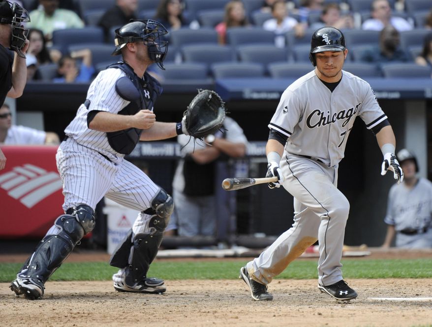 New York Yankees catcher Brian McCann, left, reacts as Chicago White Sox batter Carlos Sanchez pops out to end the baseball game Saturday, Aug. 23, 2014, at Yankee Stadium in New York. The Yankees won 5-3. (AP Photo/Bill Kostroun)
