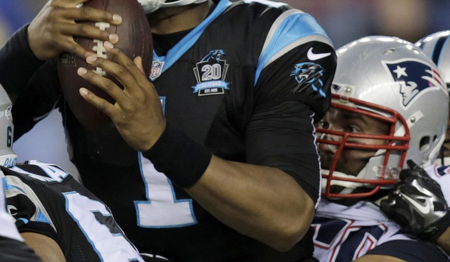 New England Patriots defensive end Rob Ninkovich, right, sacks Carolina Panthers quarterback Cam Newton (1) in the first half of an NFL preseason football game Friday, Aug. 22, 2014, in Foxborough, Mass. (AP Photo/Charles Krupa)
