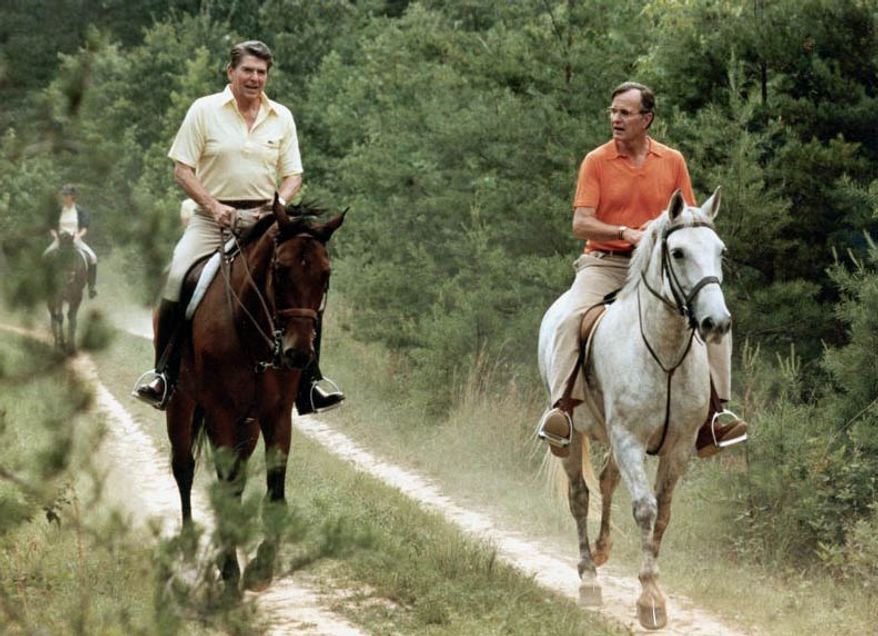 ** FILE ** U.S. President Ronald Reagan, left, and Vice President George Bush go horseback riding at Camp David, Md., July 1981. (Associated Press)
