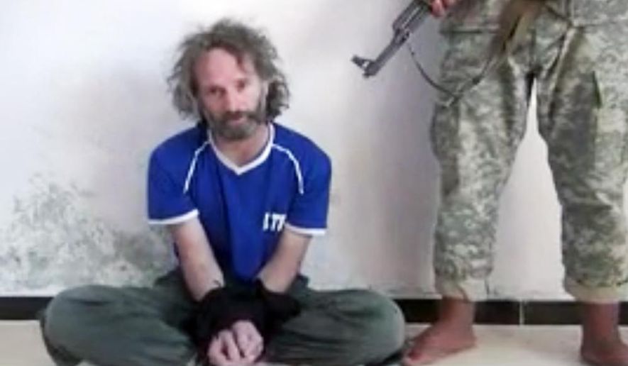 In this image made from undated video obtained by The Associated Press, which has been authenticated based on its contents and other AP reporting, a man believed to be Peter Theo Curtis, a U.S. citizen held hostage by an al-Qaida linked group in Syria, delivers a statement. The U.S. government said on Sunday, Aug. 24, 2014 that Curtis, who had been held hostage for about two years, had been released. (AP Photo)