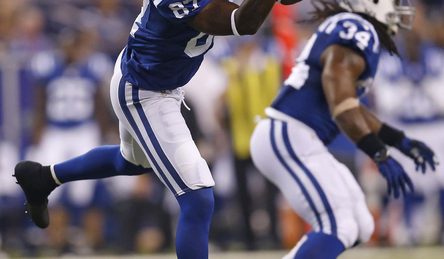Indianapolis Colts wide receiver Reggie Wayne makes a catch against the New Orleans Saints during the first half of an NFL preseason football game in Indianapolis, Saturday, Aug. 23, 2014. Wayne caught two passes, but both were wiped out by penalties. (AP Photo/Sam Riche)