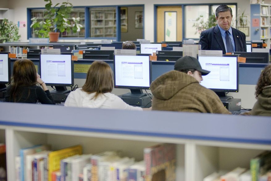This April 15, 2008 file photo shows state superintendent of schools, Tom Luna, visiting Coeur d'Alene High School as students take the Idaho Standard Achievement Test (ISAT) in Coeur d'Alene, Idaho. (AP Photo/Coeur d'Alene Press, Shawn Gust) ** FILE **