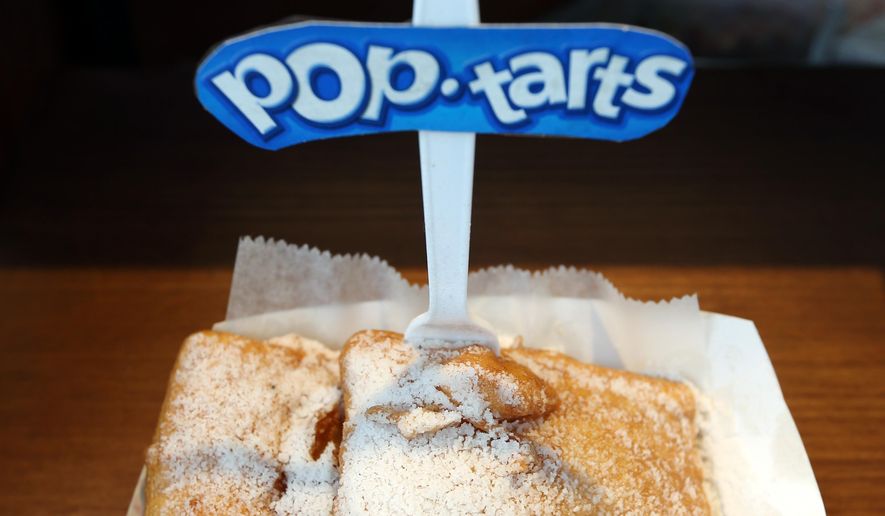 Deep fried Pop-Tarts are on display at a food vendor at the Washington County Fair on Thursday, Aug. 21, 2014, in Greenwich, N.Y. The creators of fair concoctions say they work all year to outdo themselves and the other vendors vying for the attention of an ever more expectant public. (AP Photo/Mike Groll)