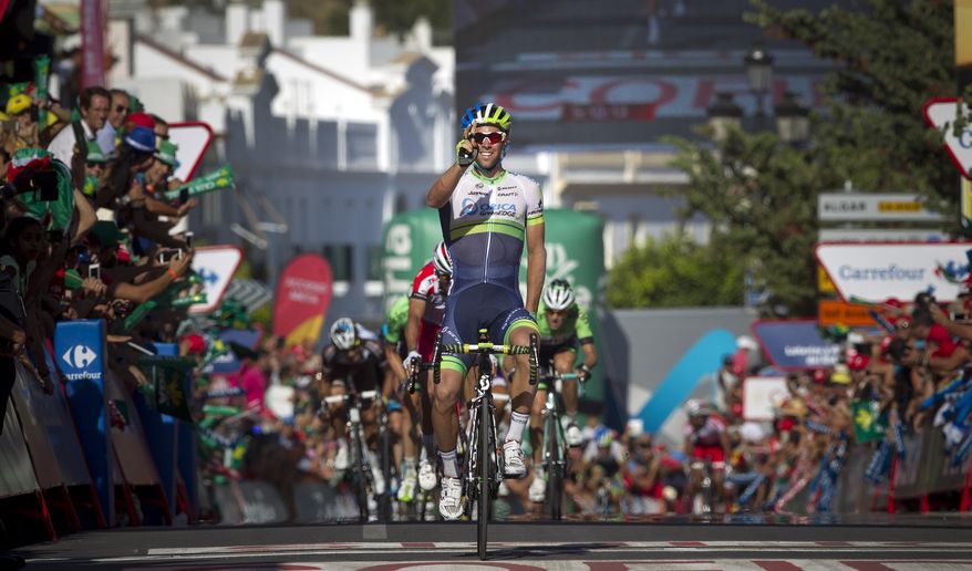 Australian rider Michael Matthews of Orica GreenEdge celebrates his victory on the finish line of the third stage of the Spanish Vuelta, in Arcos de La Frontera, Cadiz, Spain, Monday Aug. 25, 2014. The third stage of the Spanish Vuelta cycling race over 188 kilometers started in Cadiz. (AP Photo/Miguel Angel Morenatti)