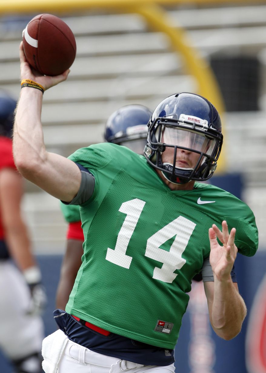 In this Aug. 9, 2014 photo, Mississippi quarterback Bo Wallace passes during the team's final open NCAA college football practice, in Oxford Miss. Wallace, now in his third year as the starter will be counted on to lead his team as they face Boise State in their season opener on Thursday, Aug. 28. (AP Photo/Rogelio V. Solis)