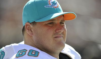 FILE - In this Sept. 8, 2013, file photo, Miami Dolphins guard Richie Incognito (68) looks on during an NFL football game against the Cleveland Browns in Cleveland. The Tampa Bay Buccaneers are going to meet with Richie Incognito to determine if one of the central figures in the Miami Dolphins bullying scandal can help their struggling offensive line. Coach Lovie Smith emphasized Monday, Aug. 25, 2014,  that the Bucs had arranged a ``visit&#39;&#39; by the free agent guard but that a signing wasn&#39;t necessarily imminent. (AP Photo/David Richard, File)