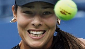 Ana Ivanovic, of Serbia, returns a shot against Alison Riske, of the United States, during the opening round of the 2014 U.S. Open tennis tournament, Tuesday, Aug. 26, 2014, in New York. (AP Photo/Kathy Willens)