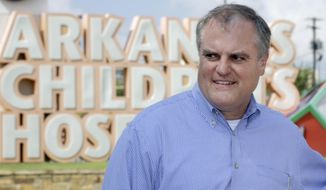 U.S. Sen. Mark Pryor, D-Ark., walks near near an entrance to Arkansas Children&#39;s Hospital in Little Rock, Ark., after a news conference Tuesday, Aug. 26, 2014. Pryor faces a challenge from Republican Congressman Tom Cotton in the November election. (AP Photo/Danny Johnston)