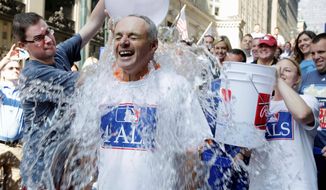 participates in the ALS Ice-Bucket Challenge outside the organization&#x27;s headquarters in New York, Wednesday, Aug. 20, 2014. Manfred participated with more than 160 other MLB employees to raise more than $16,000 for the ALS Association. (AP Photo/Vanessa A. Alvarez)