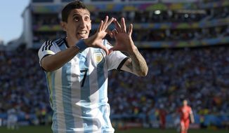 Argentina&#x27;s Angel di Maria celebrates after scoring his side&#x27;s only and winning goal in extra time during the World Cup round of 16 soccer match between Argentina and Switzerland at the Itaquerao Stadium in Sao Paulo, Brazil, Tuesday, July 1, 2014. Argentina defeated Switzerland 1-0 to move on to the quarterfinals. (AP Photo/Manu Fernandez)