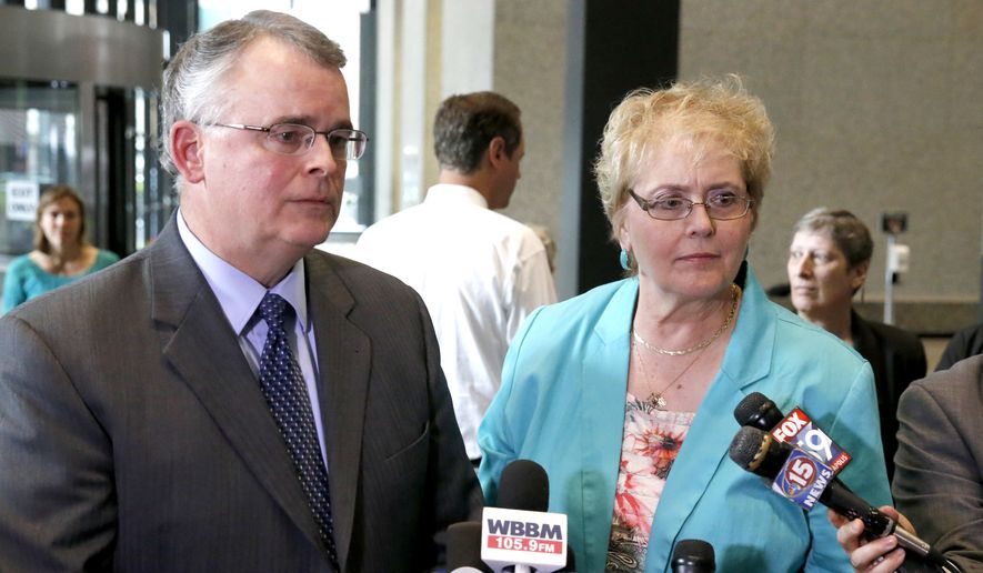 Julaine Appling, president of Wisconsin Family Action, right, and her organization&#x27;s attorney Mike Dean, defenders of Wisconsin&#x27;s state ban on gay marriage, talk to reporters after attending a hearing before the 7th U.S. Circuit Court of Appeals on the challenges to Indiana and Wisconsin&#x27;s gay marriage ban Tuesday, Aug. 26, 2014, in Chicago. (AP Photo/Charles Rex Arbogast)