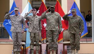 Outgoing commander of ISAF, U.S. Gen. Joseph Dunford, first left, and incoming U.S. Army Commander for International Security Assistance Forces (ISAF), Gen. John F. Campbell, first right, salute during a change of command ceremony at the ISAF Headquarters in Kabul, Afghanistan, Tuesday, Aug. 26, 2014. ISAF is a NATO-led security mission in Afghanistan that was established by the United Nations Security Council in 2001. It will end its mission at the end of 2014. (AP Photo/Massoud Hossaini)